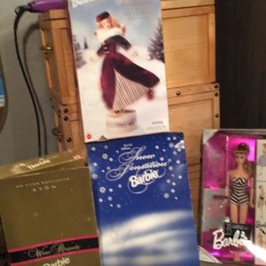 4 never opened limited editions Barbies packages are still great
